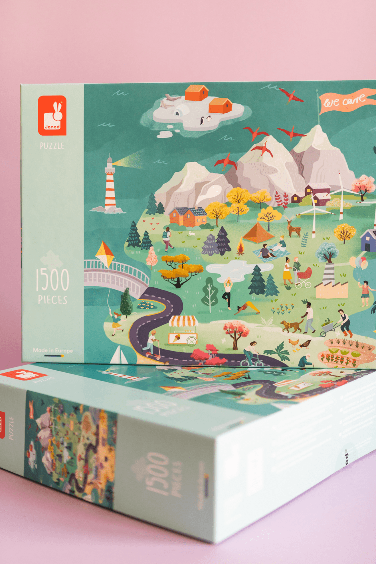 A colorful illustrated puzzle box featuring a scenic landscape with mountains, mountainside houses, a lighthouse, trees, and various activities like people walking, biking, and picnicking. The box indicates 1500 pieces and is made in Europe.