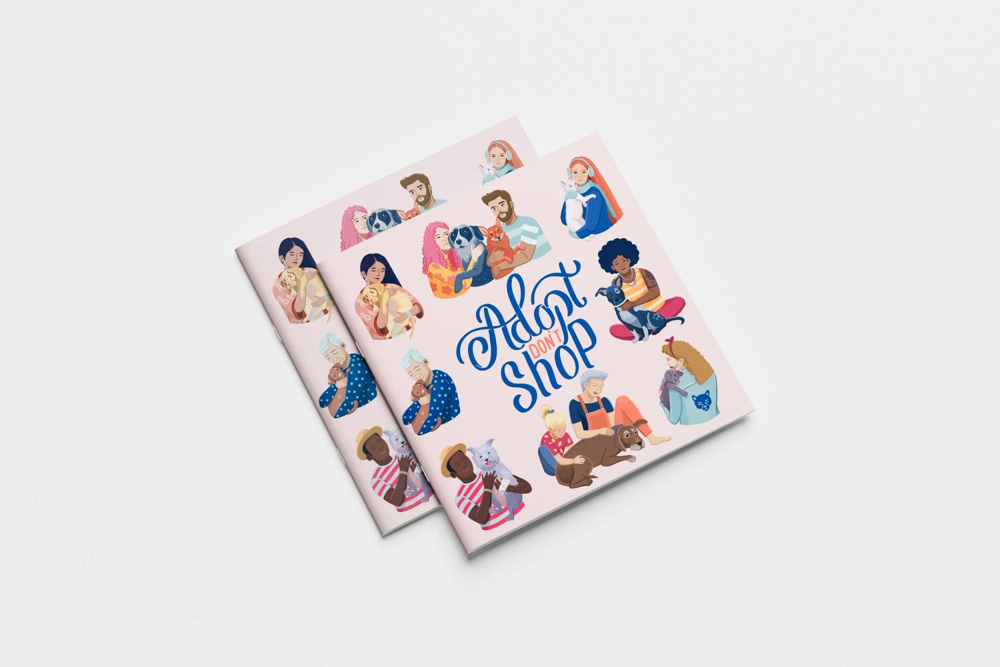 Two magazines with illustrations of diverse people and their dogs on the covers, titled "Adopt Don't Shop".
