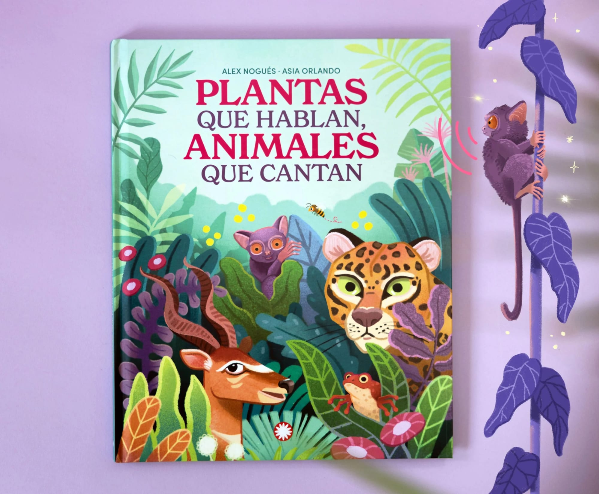 Book cover titled 'Plantas que hablan, animales que cantan' featuring colorful illustrations of jungle animals including a jaguar, frog, snake, and lemur surrounded by lush green foliage.