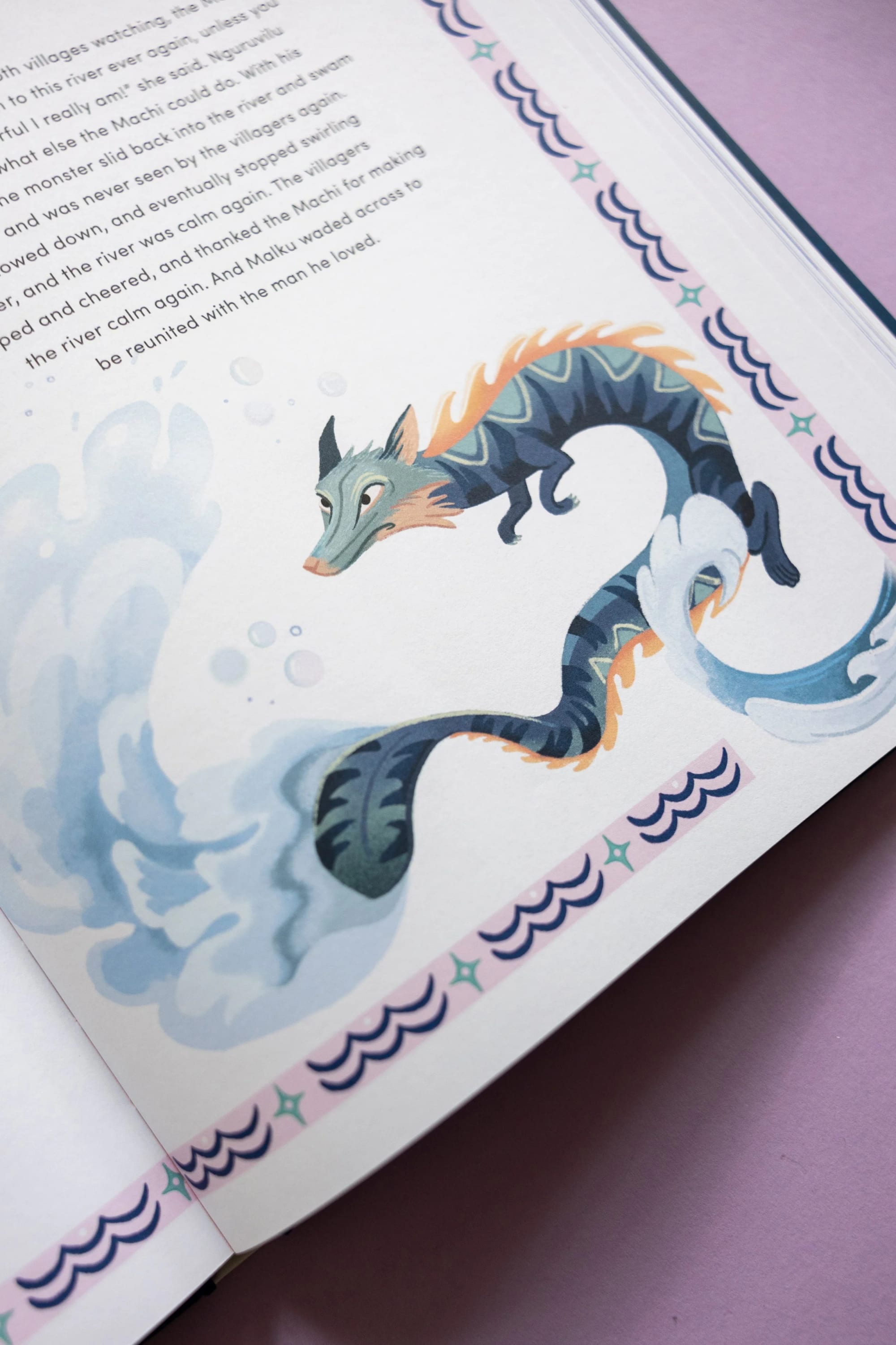 Illustration of a water serpent with a dragon-like head and a long, curving body, depicted in shades of blue, black, and orange, emerging from stylized water splashes.