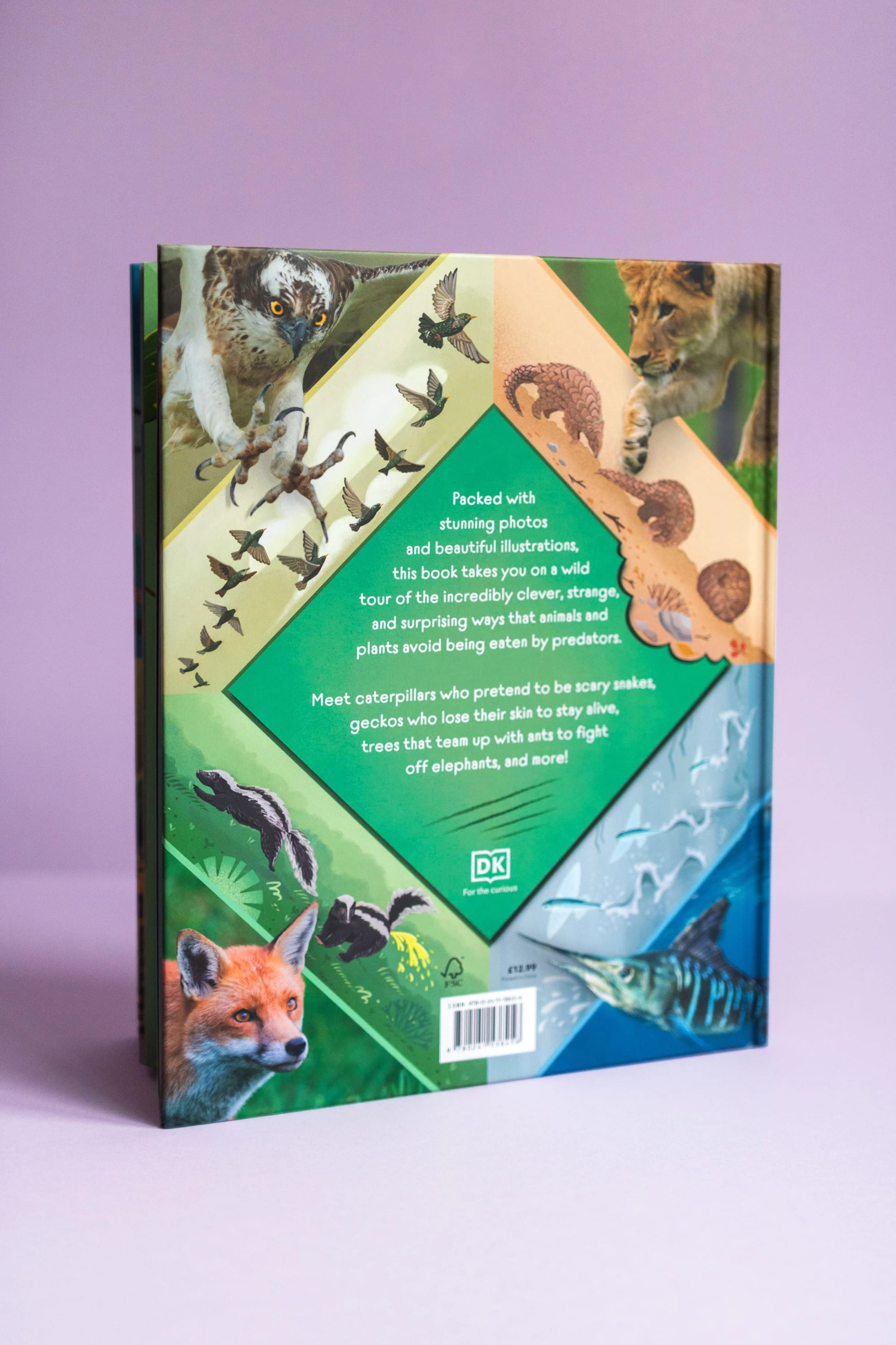 A book with colorful animal illustrations on the cover, featuring a bird, a lion, a fox, and fish. The back cover has a description about animals and plants' survival strategies.