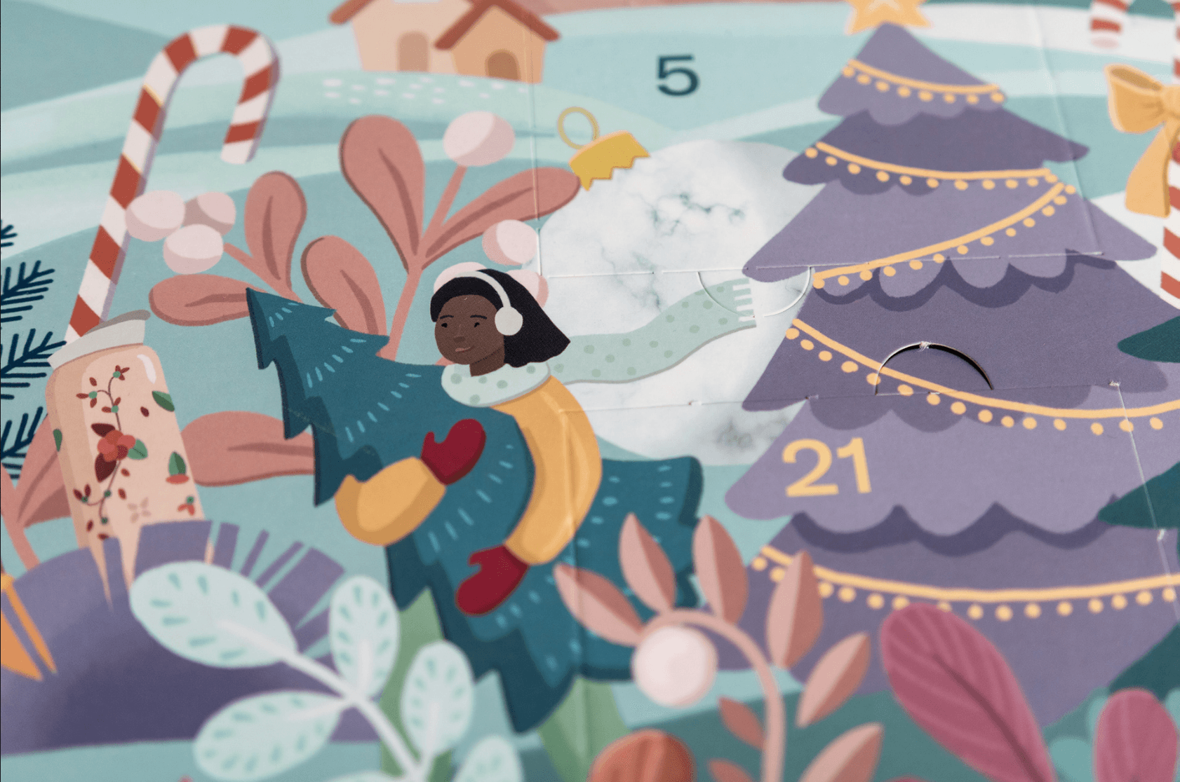 Illustration of a woman with dark skin and black hair, wearing earmuffs and a yellow coat, installing a star on a decorated Christmas tree, surrounded by holiday decorations and foliage, with an Advent calendar numbered 21 visible.