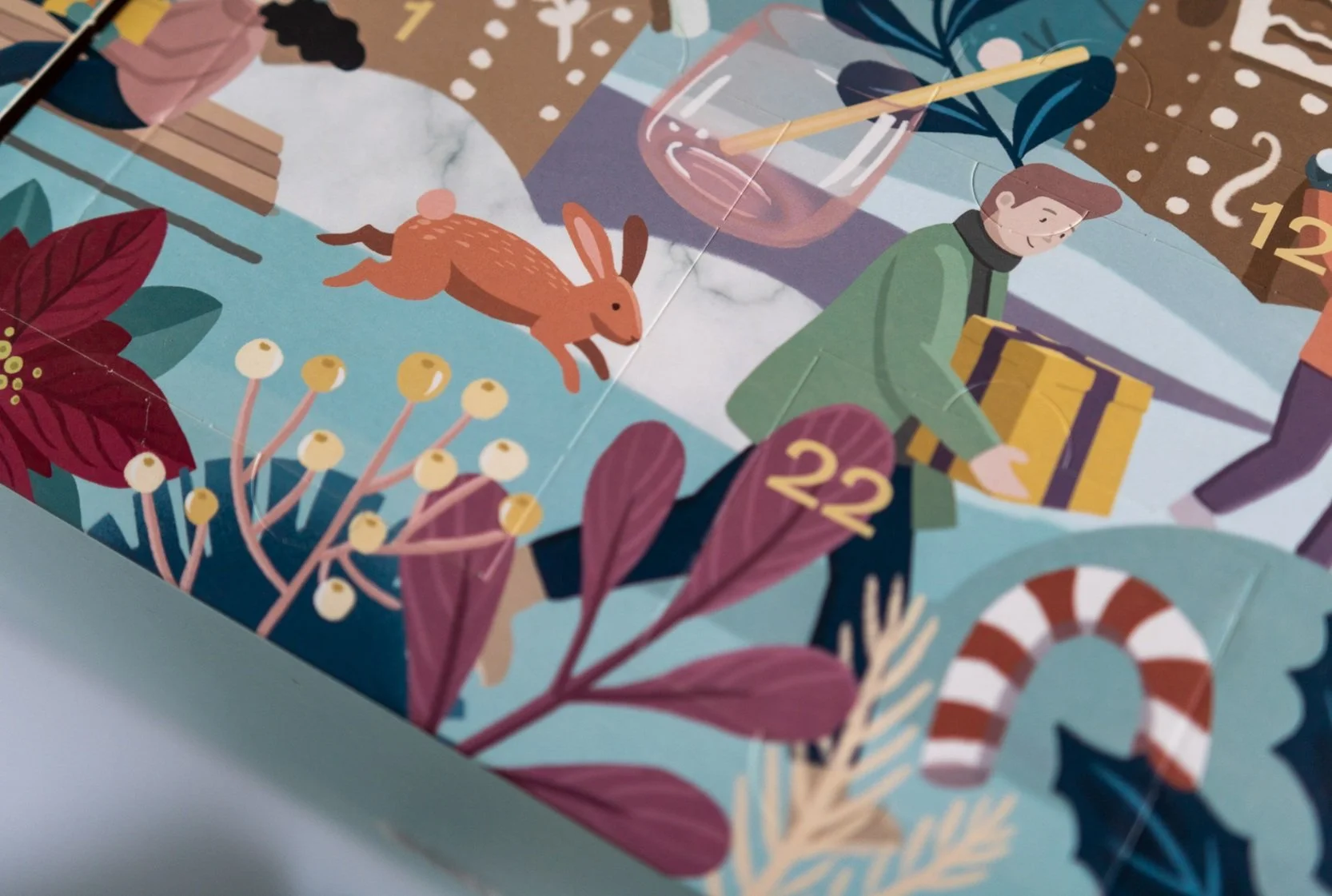 Illustrated holiday scene featuring a man holding a gift, a rabbit, Christmas foliage, a candy cane, and numbered doors from a festive advent calendar.