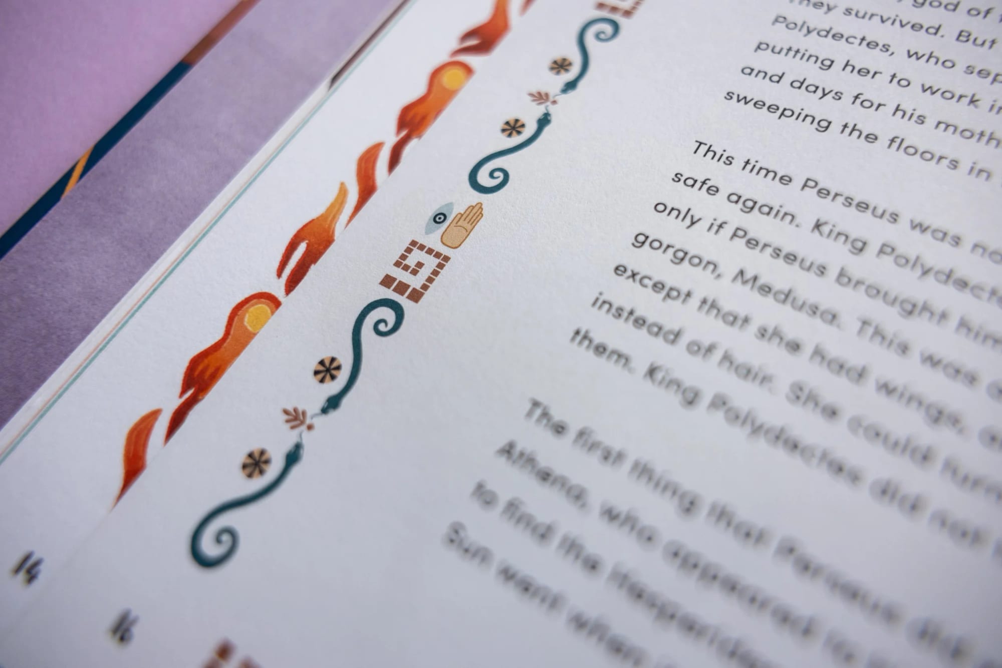 Close-up of a book page with decorative illustrations of flames, swirls, and geometric shapes along the margin.