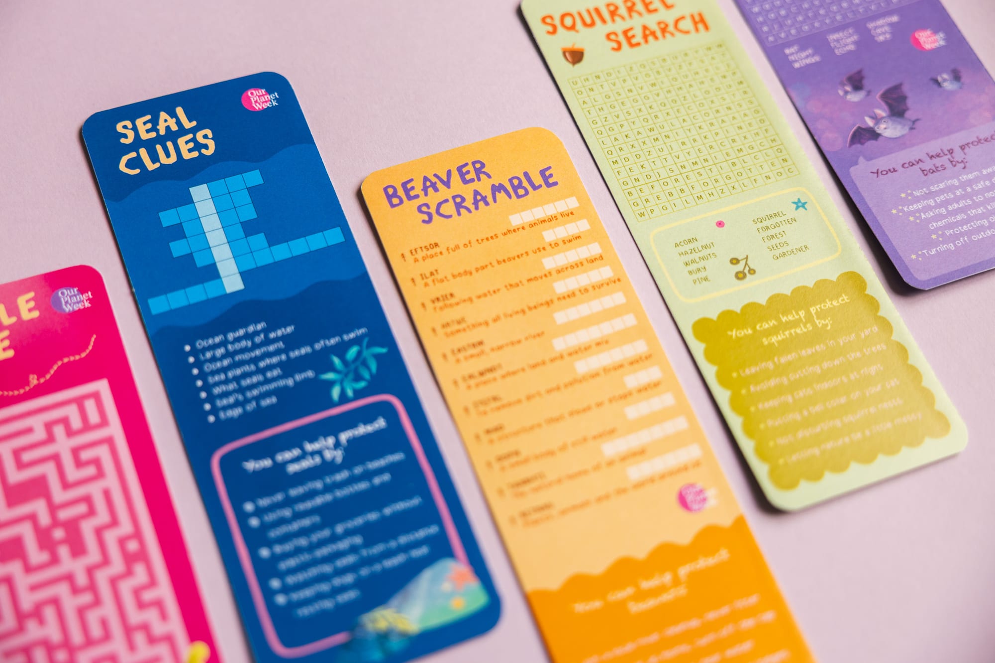 Backs of the bookmarks — mini puzzles, crosswords, scrambles and word searches.